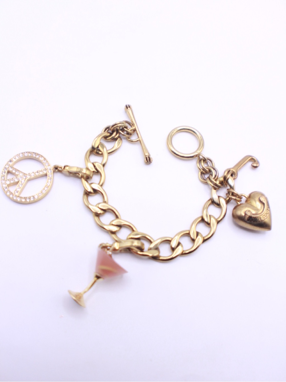 Juicy Couture Gold Charm Bracelet with Pink Martini, Heart & Peace Charms 7”